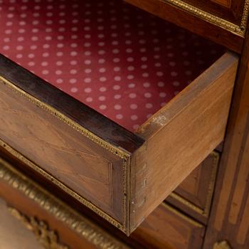 A Louis XVI-style chest of drawers, circa 1900.