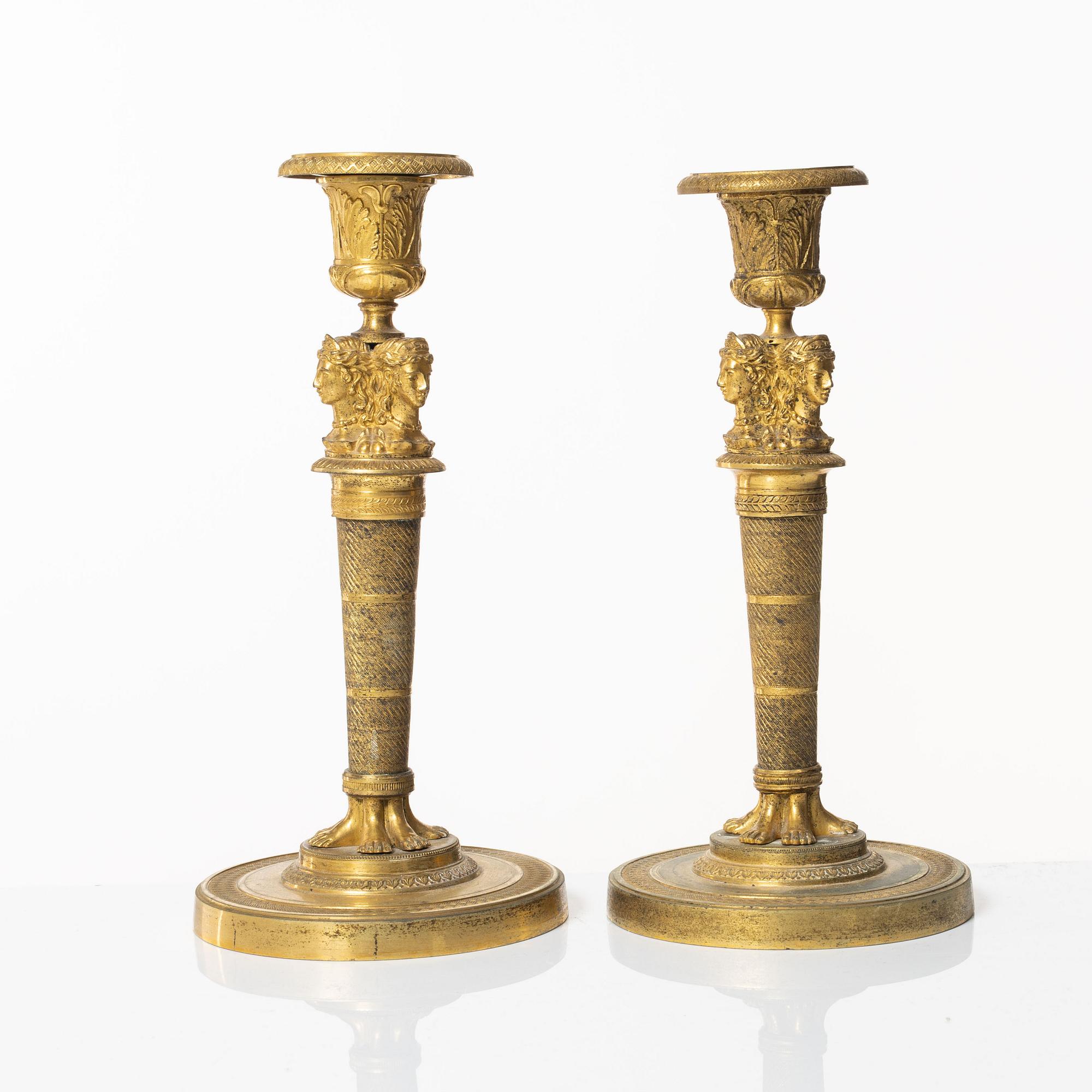 A matched pair of candlesticks, Empire, France, first half of the 20th century.