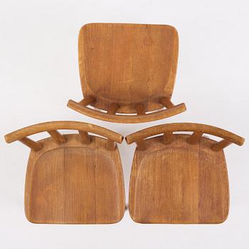 Axel Einar Hjorth, a set of three stained pine "Utö" chairs, Nordiska Kompaniet, Sweden, 1930s.