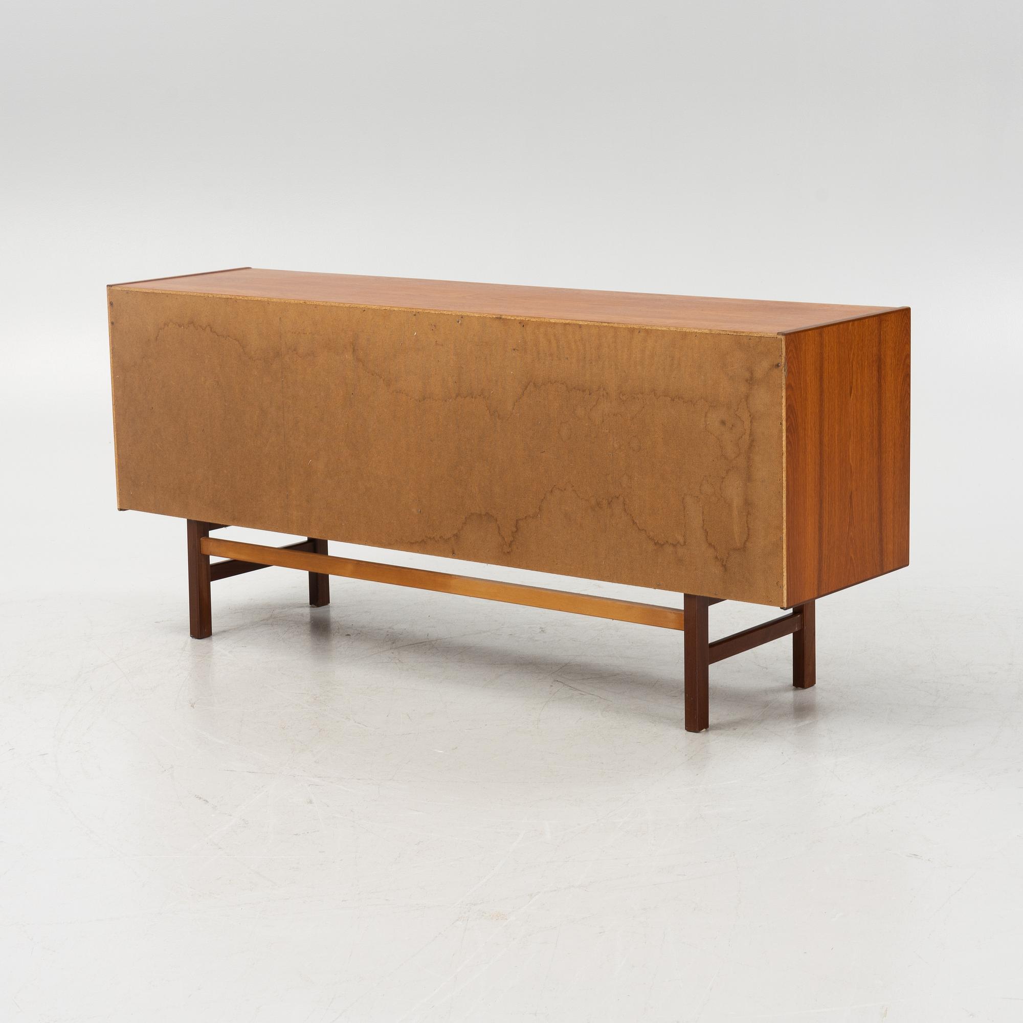 A 1960's teak-veneered sideboard.