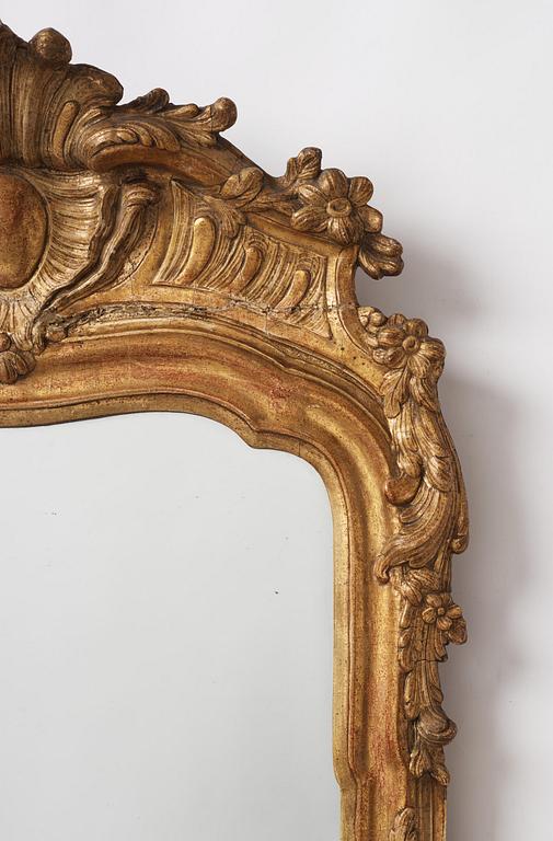 A Swedish rococo giltwood mirror, Stockholm later part 18th century.