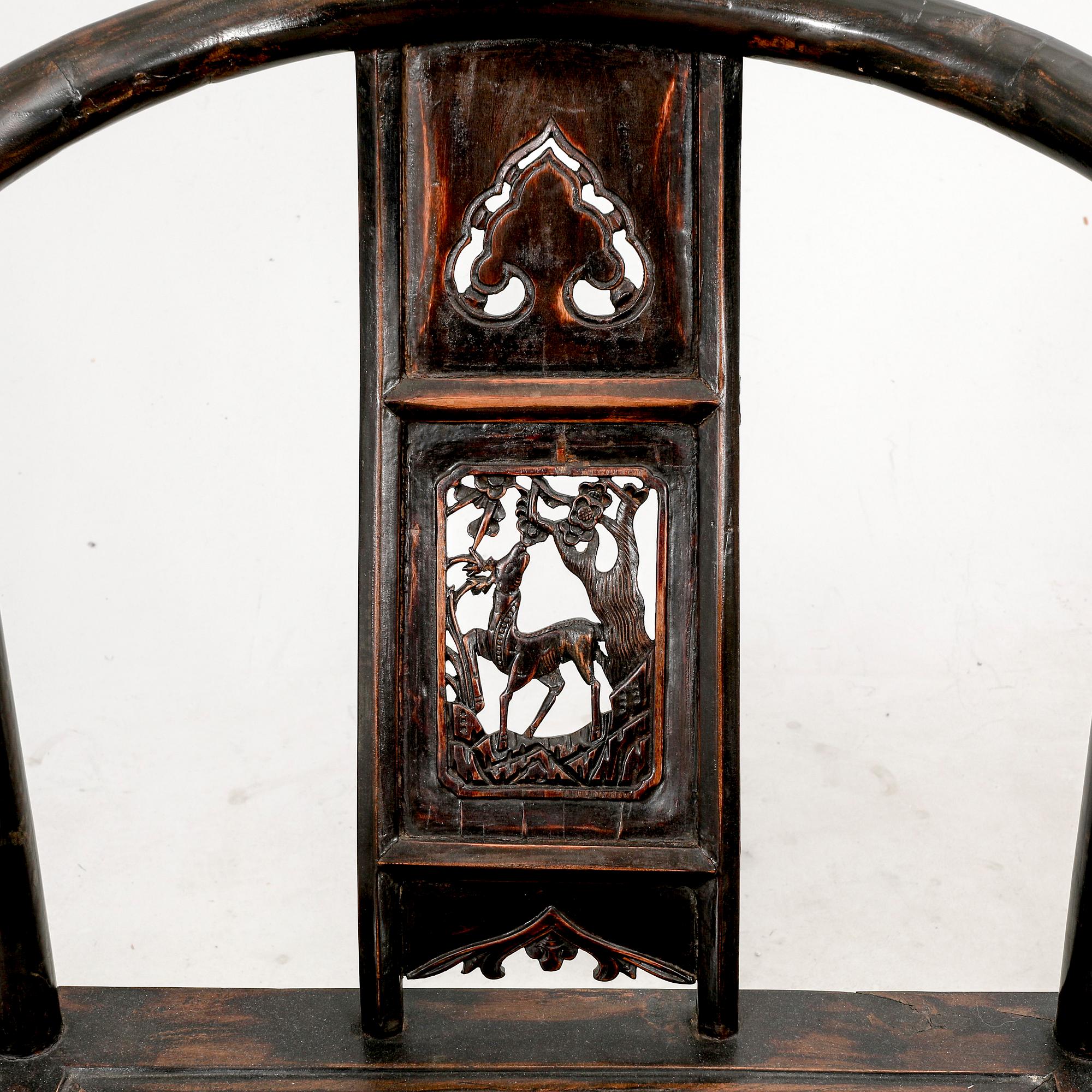 A pair of Chinese hardwood armchairs, circa 1900.