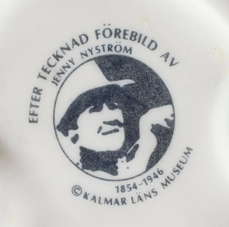 JULKRUBBA, 15 delar, porslin, efter Jenny Nyström, Kalmar Länsmuseum.