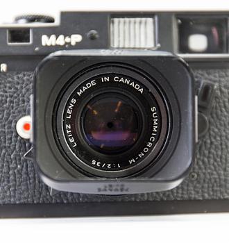 a black body Leica M4-P camera with no 1605951 made by Leitz Canada in 1982. With two lenses and a Leica Meter.