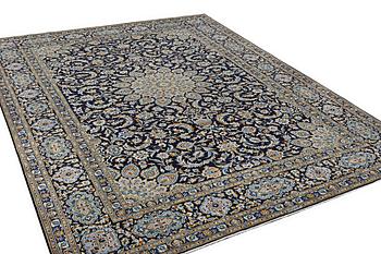 A Kashan carpet, c. 410 x 311 cm.