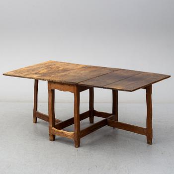 An 18th century gateleg table.