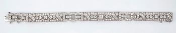 A brilliant- and step-cut diamond bracelet. Total carat weight circa 8.10 cts.