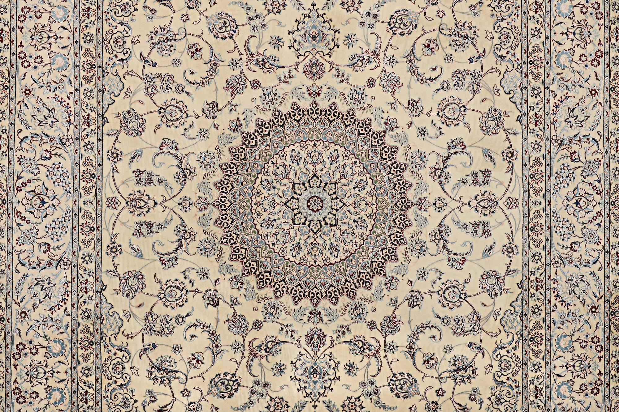 A Nain carpet, part silk, 6 laa, c. 295 x 205 cm.
