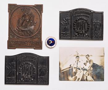 3 sailing plaques, 1 club badge, and a photo.