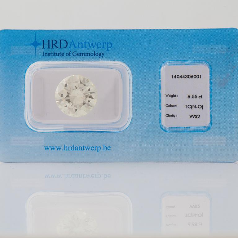 A loose 6.55 ct brilliant cut diamond. Quality N-O/VVS2, HRD certificate.