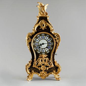 A 19th century mantle clock in the style of Louis XV.
