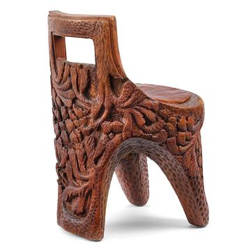 129. Knut Fjaestad, an Art Nouveau sculpted and carved pine chair, Sweden, 1915.