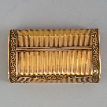 A brass music box, about 1900.