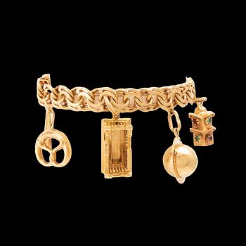 An 18K gold bracelet with charms.