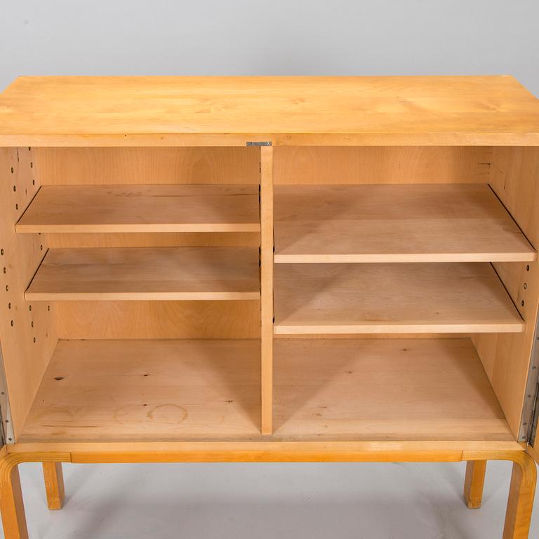 Alvar Aalto, mid-20th century '810' cabinet and a 
'69'chair Oy Huonekalu- ja Rakennustyötehdas Ab.