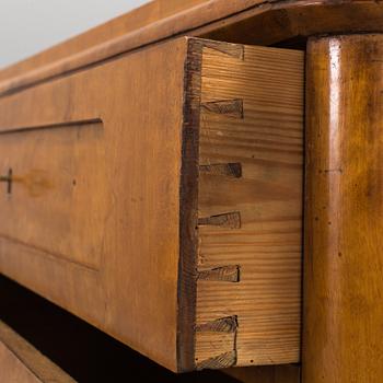 A late empire chest of drawers, mid 19th century.