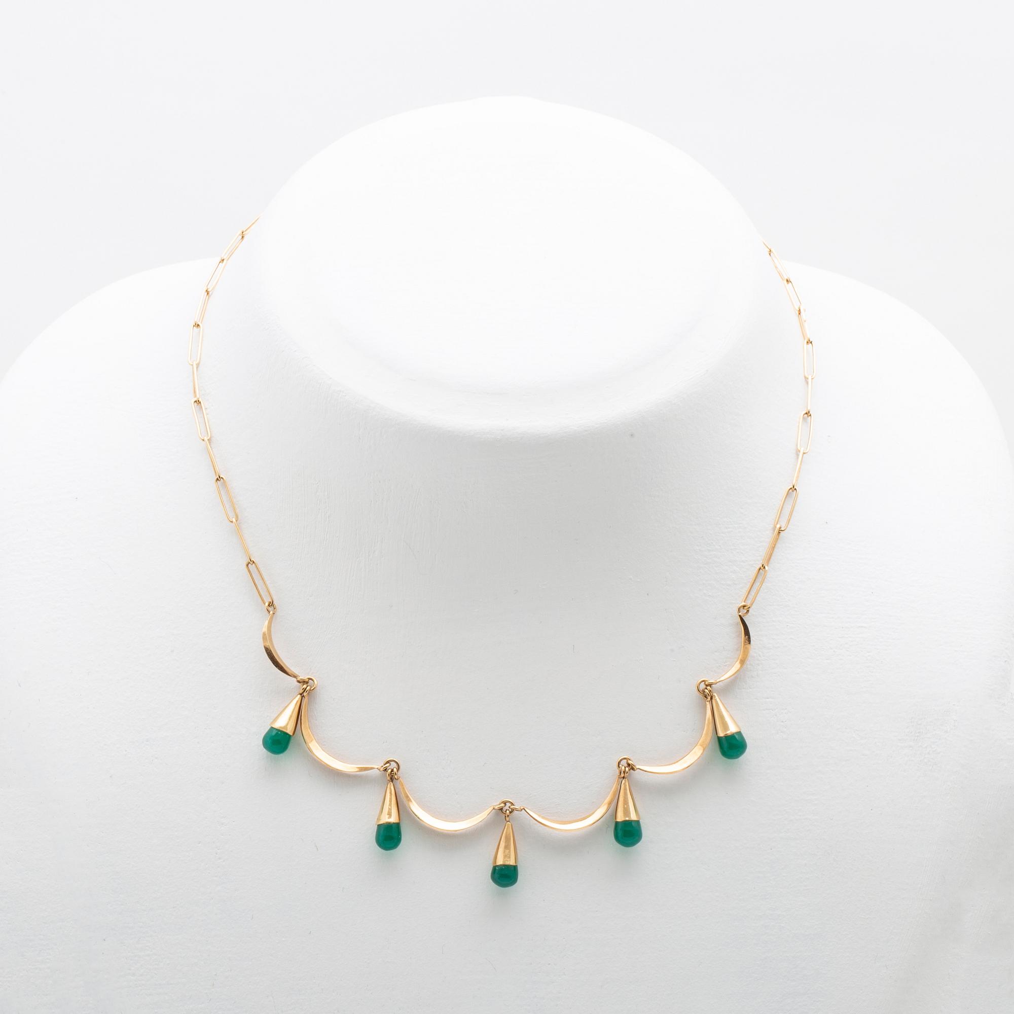 An 18K gold neckalce and a pair of earring set with green stones.