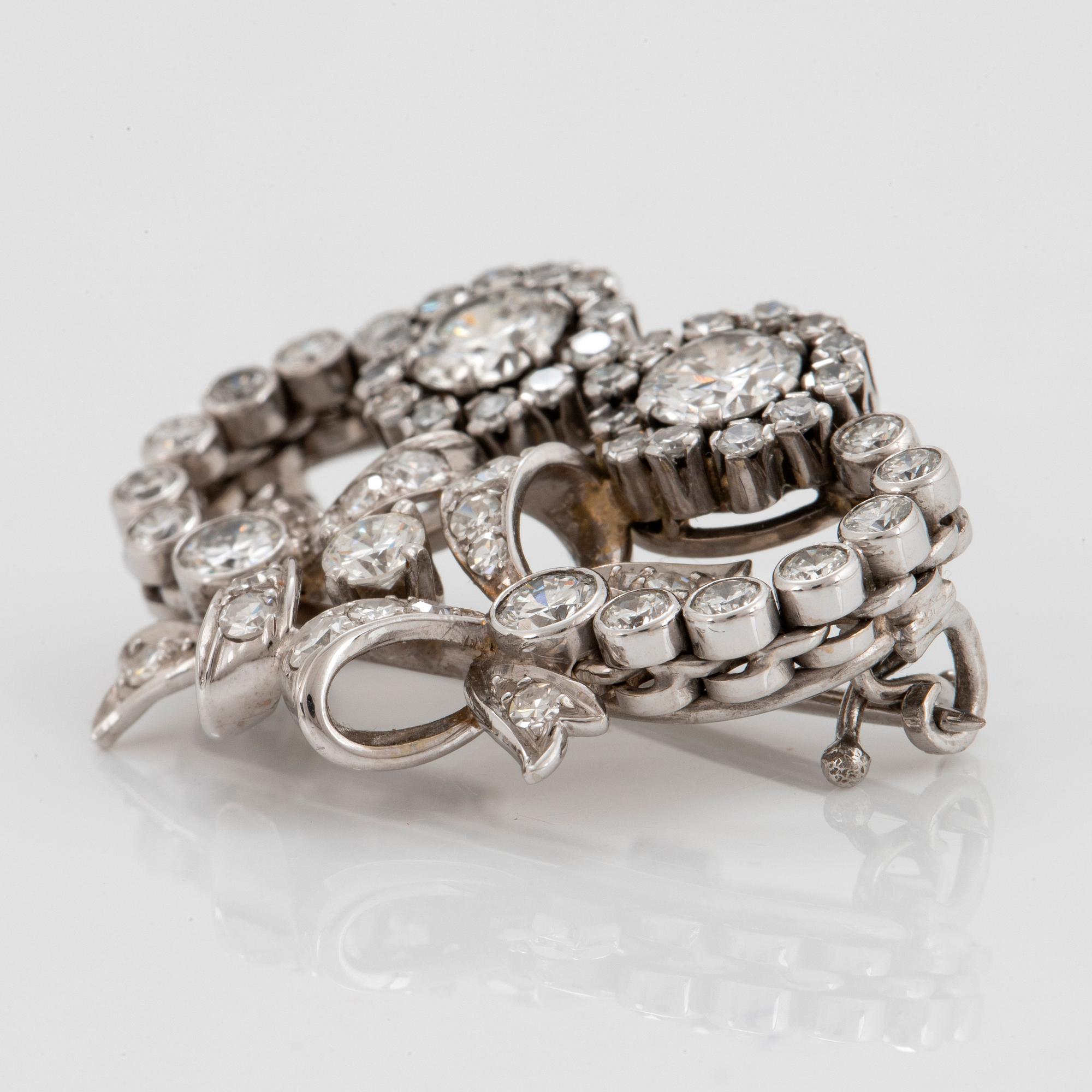 Brosch 18K vitguld med runda briljant- och åttkantslipade diamanter.