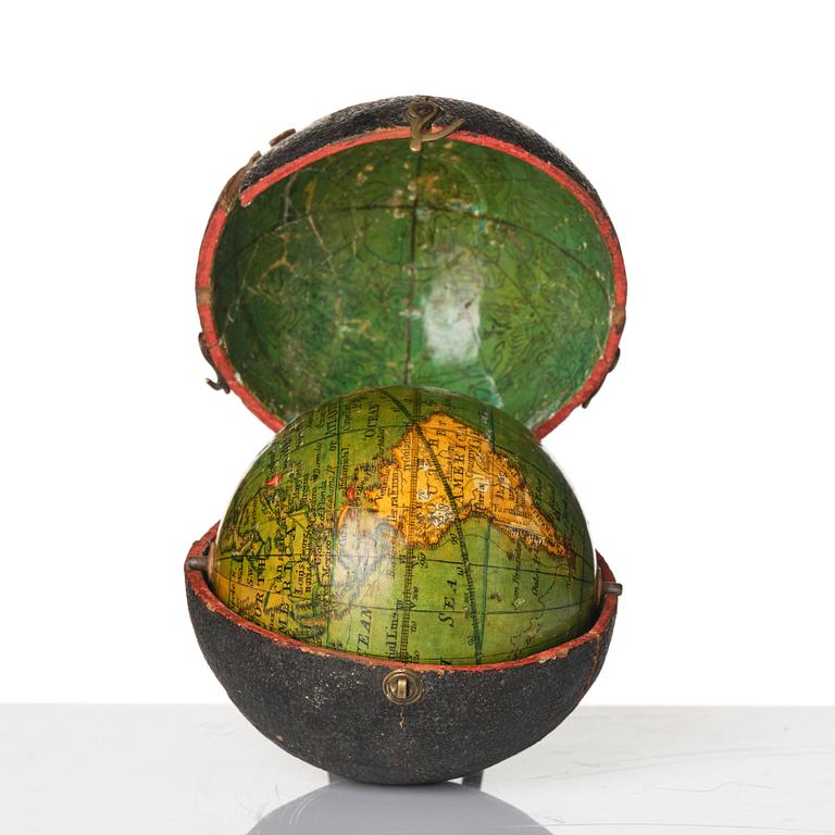 A Georgian 2.75 inch pocket globe with case by T. Harris & son (active in London 1802-1907), dated 1812.