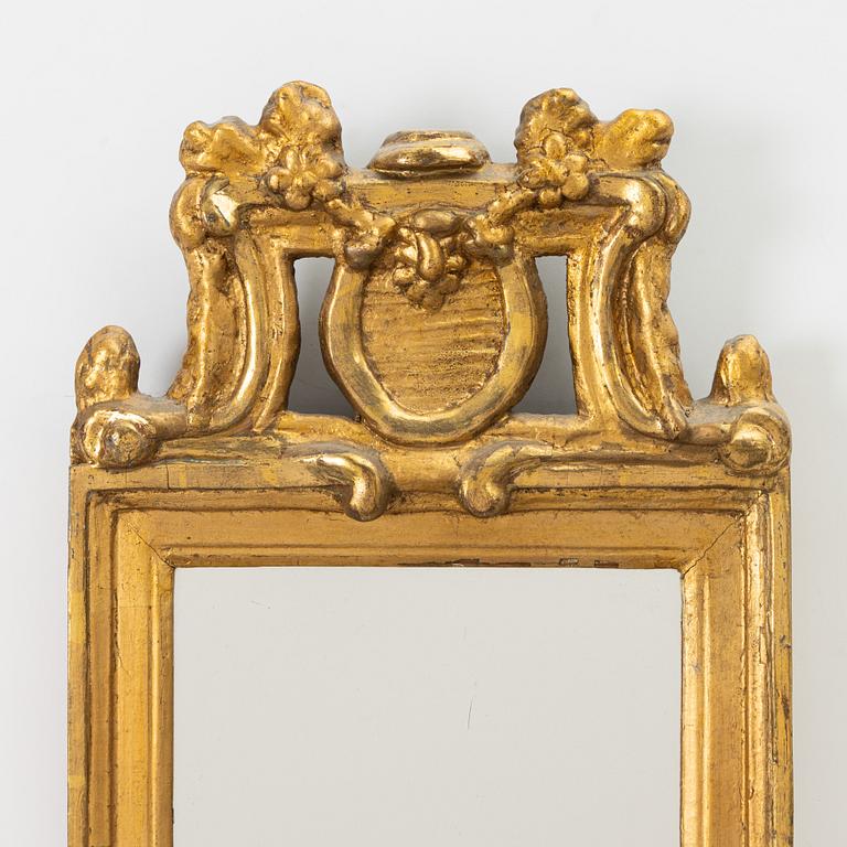 A Gustavian giltwood mirror, late 18th century.