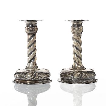 A pair of Baroque style silver candlesticks, marks of CG Hallberg, Stockholm 1942.