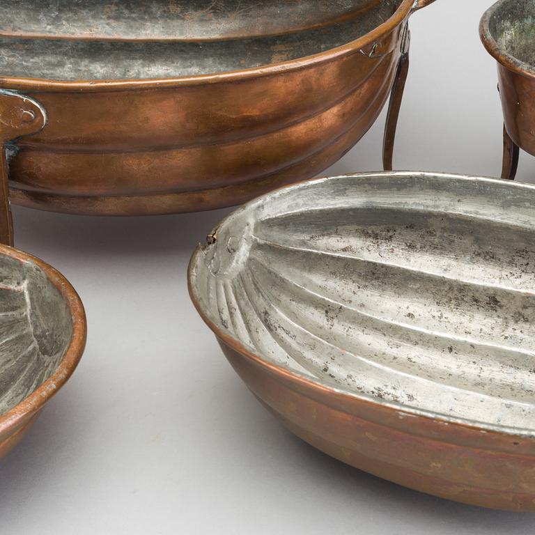 Six 19th century copper pots and pans.