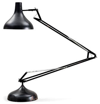 A black lacquered metal industrial floor lamp, Germany 1950's-60's.