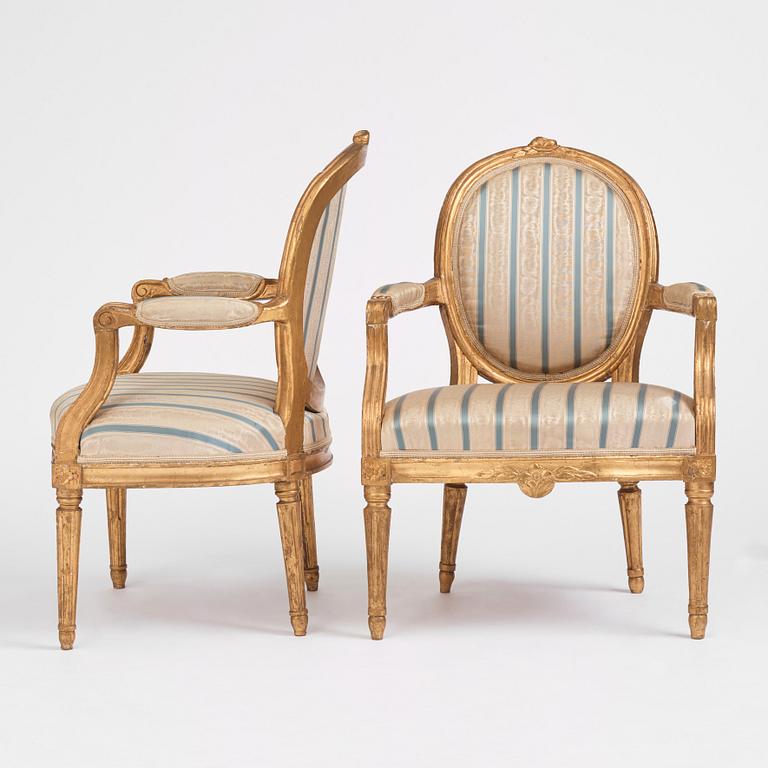 A pair of Gustavian giltwood open armchairs, late 18th century.