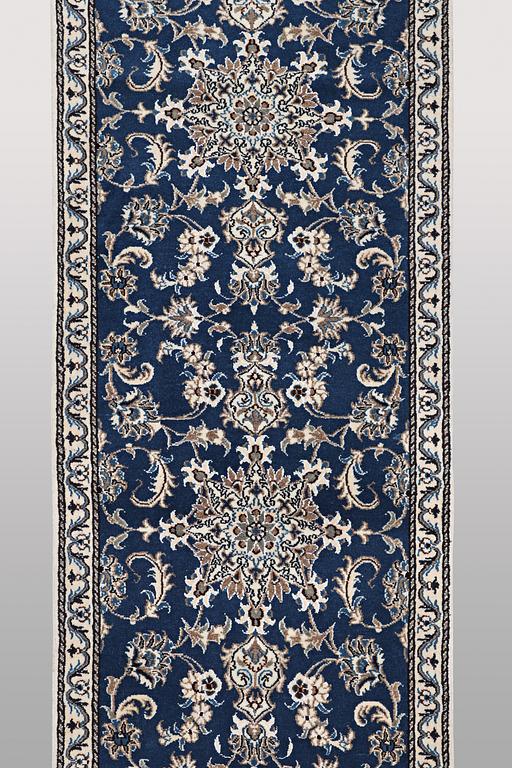 A runner carpet, Nain, part silk, ca 374 x 75 cm.