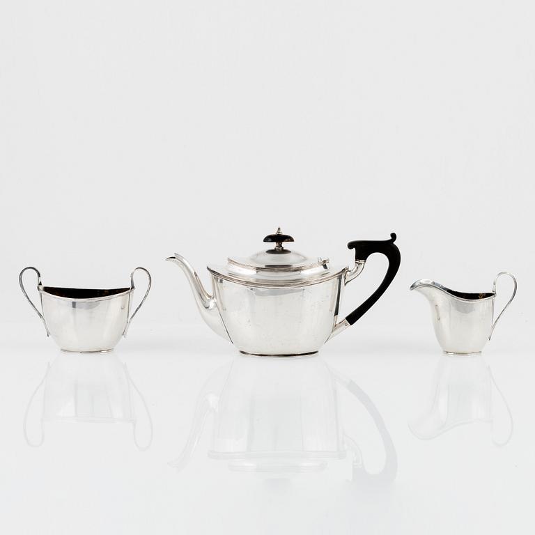 An English Silver Teapot, Creamer and Sugar Bowl, mark of Thomas Bradbury & Sons Ltd, Sheffield 1908-1910.