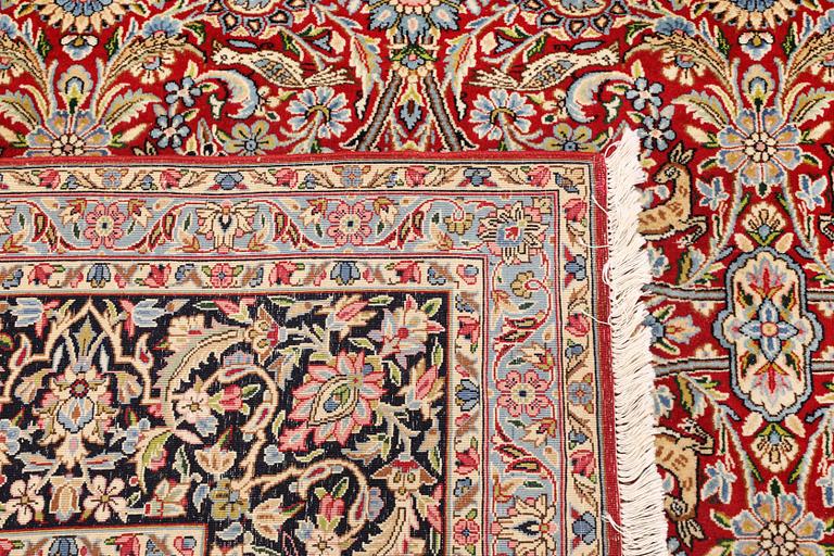A Kirman lavar carpet, 403 x 304 cm.
