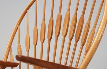 A Hans J Wegner ash and teak 'Peacock chair', Johannes Hansen, Denmark.