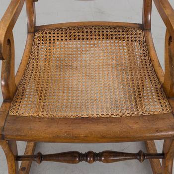 A ROCKING CHAIR LATER PART OF THE 19TH CENTURY.