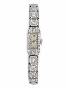 1326. A diamond ladie's wrist watch, tot. app. 3.20 cts. 1940's.