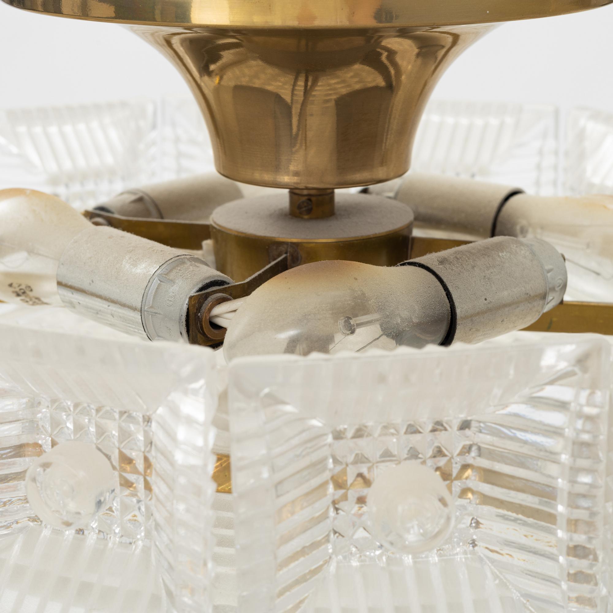 Carl Fagerlund, a pair of brass and glass ceiling lights, Orrefors.