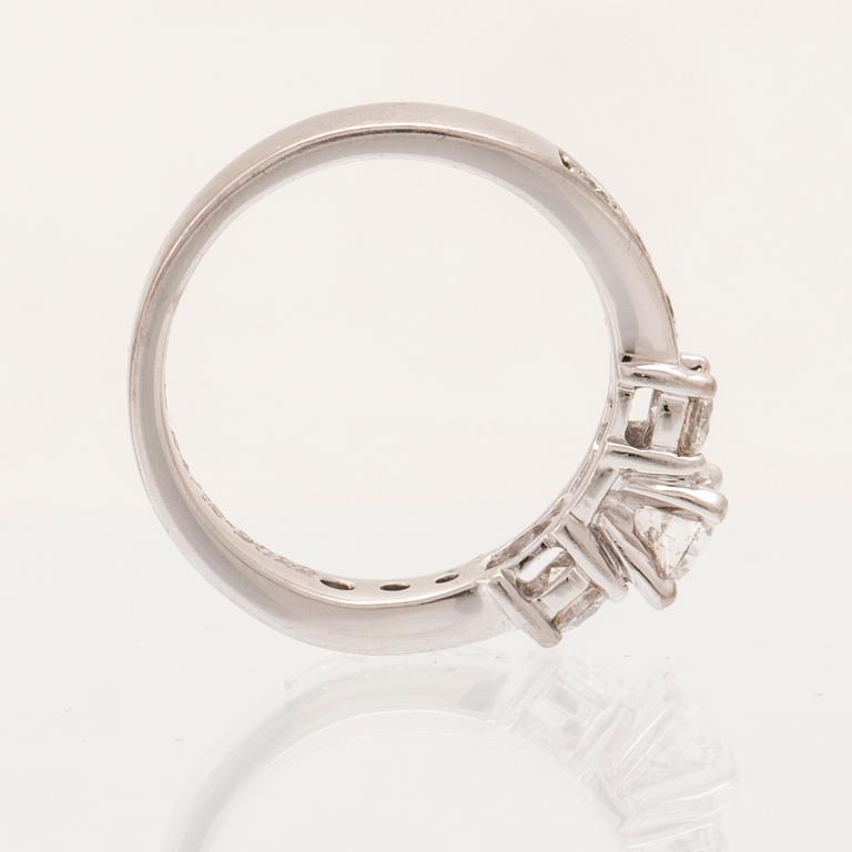 An 18K white gold ring set with round brilliant cut diamonds.