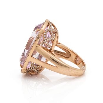 A kunzite and brilliant cut diamond ring. Total carat weighjt of diamo0nds circa 1.10 cts. Kunzite circa 30.00 cts.