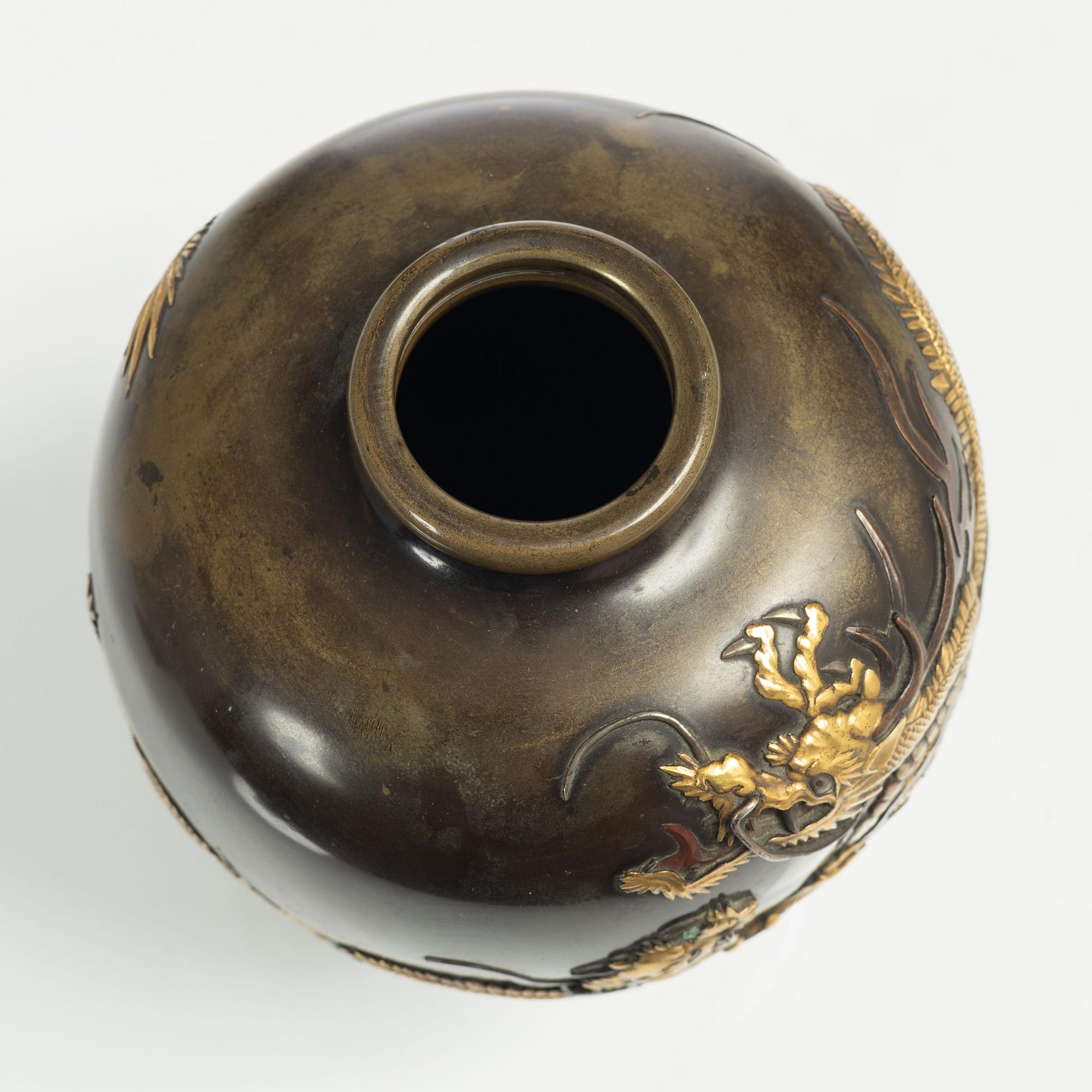 A Japanese gilt bronze and silvered dragon vase, Meiji period (1868-1912). Signed.