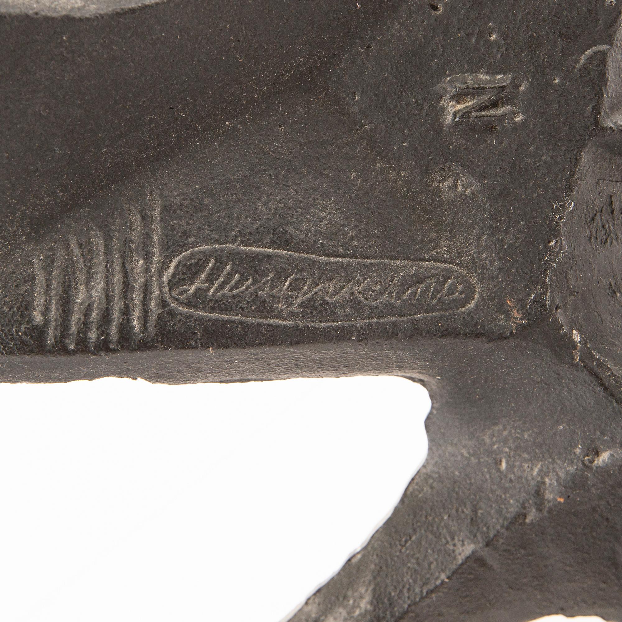 Olle Hermansson, gnistskydd, gjutjärn signerad Husqvarna 1960-tal.