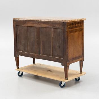 A Louis XVI-style marquetry and marble commode, later part of the 19th century.