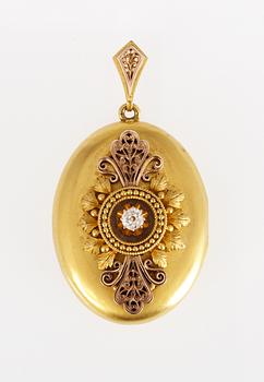 699. MEDALJONG, två färger guld med gammalslipad diamant, ca 0.20ct. 1800-tal.