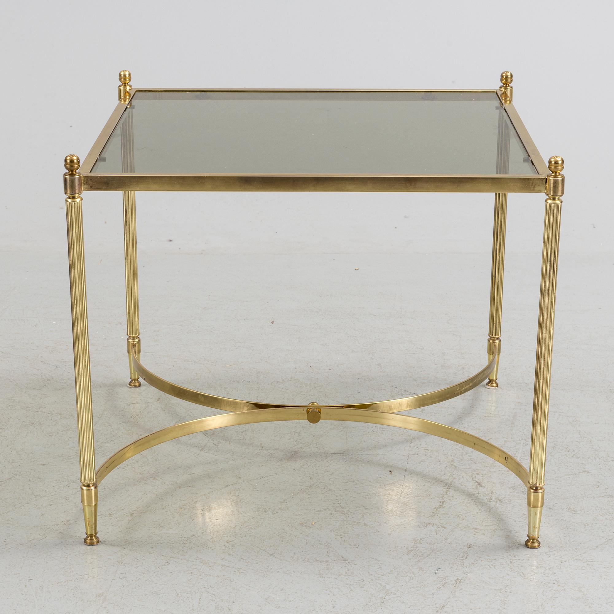 A brass and glass coffee table from the second half of the 20th century.