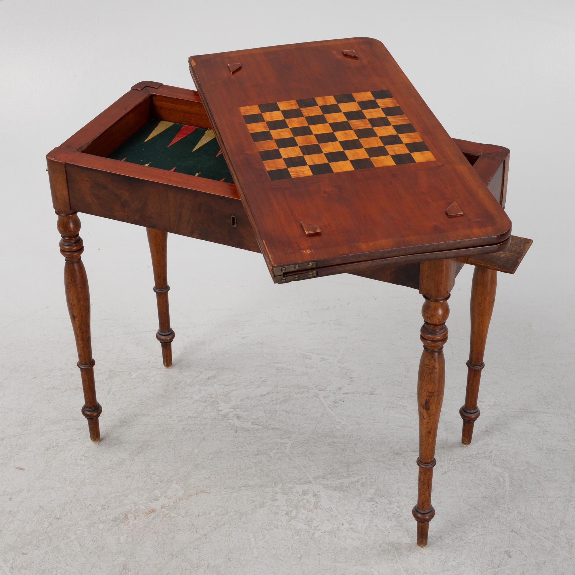A mahogany games table, mid 19th Century.