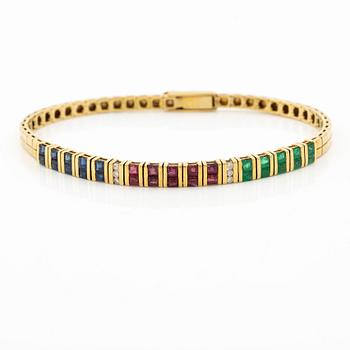 Armlänk, 18K guld med briljantslipade diamanter, carréslipade rubiner, smaragder och safirer.
