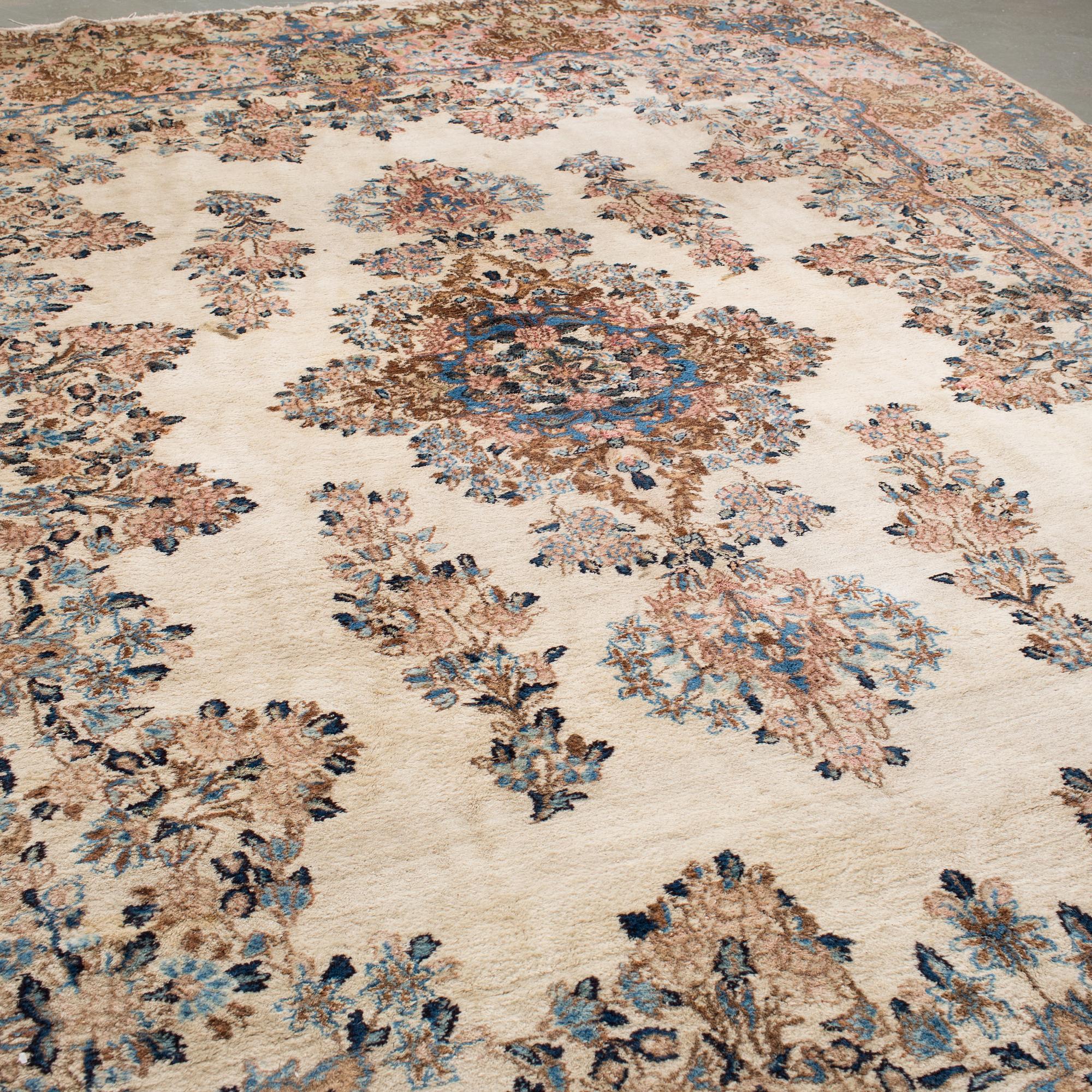 A Kerman carpet, around 360 x 262 cm.