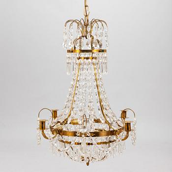 A Gustavian style chandelier from the first half of the 20th century. Height 67 cm.