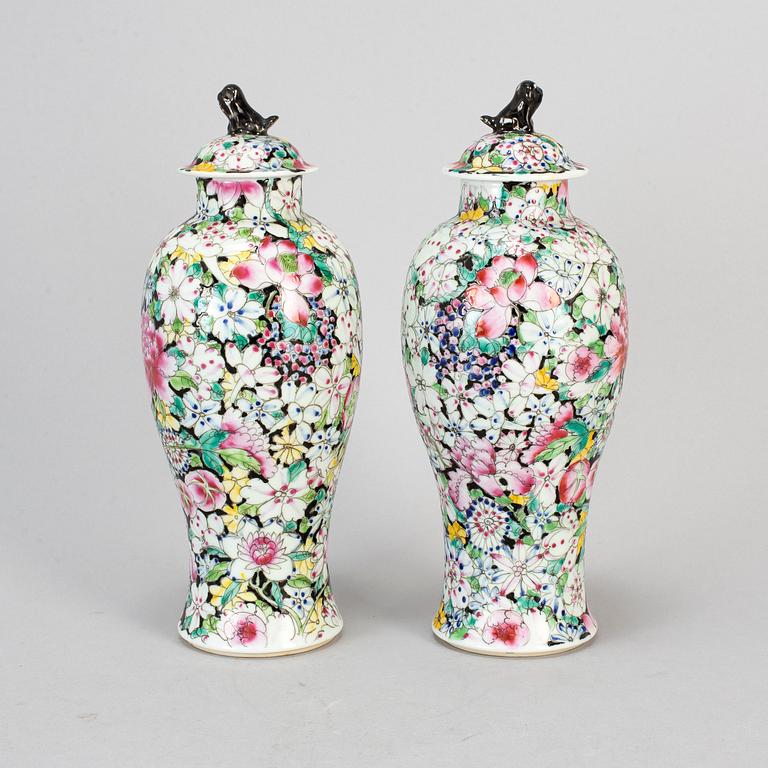 A pair of Chinese 'Mille fleur' porcelain vases with covers, 20th century.