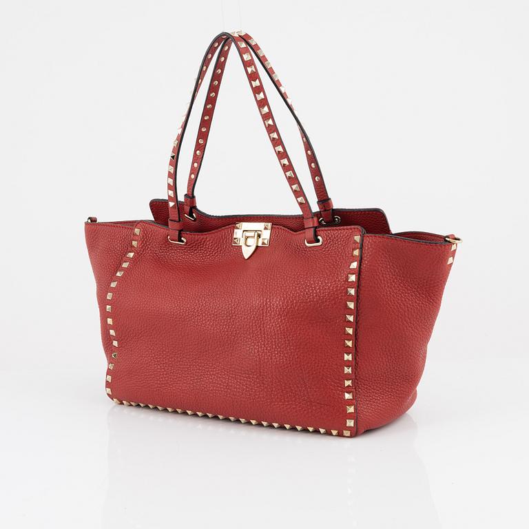 Valentino Gravani, a red leather studded tote bag, 2018.