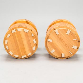 A pair of Finnish pinewood stools/ sidetables, late 20th century.