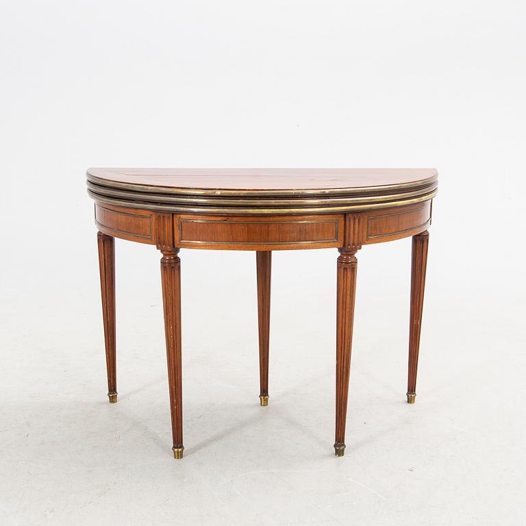 An erarly 1800s mahogany game table.